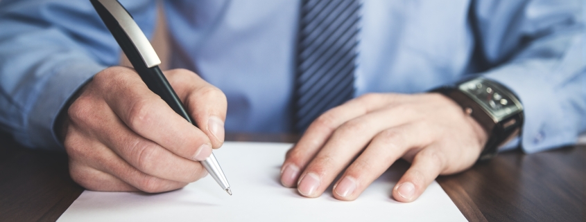 Postdoctoral fellowship. Man holding application forms.